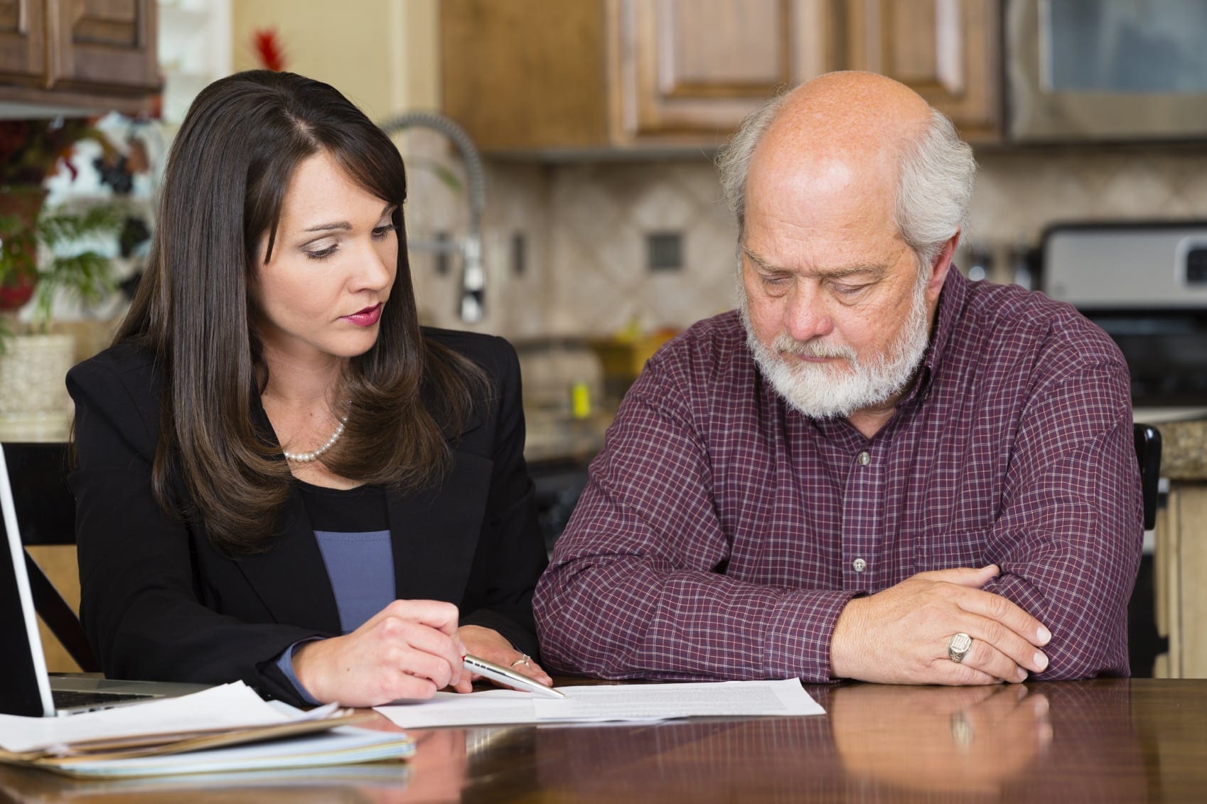 Female Attorney Explaining Legal Documents To Client Stock Photo