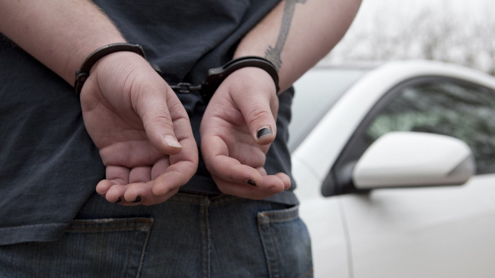 Drunk Driver Being Arrested By The Police Stock Photo