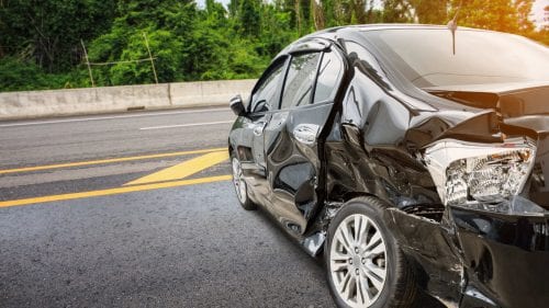 Black Car With Severe Structural Damage Stock Photo