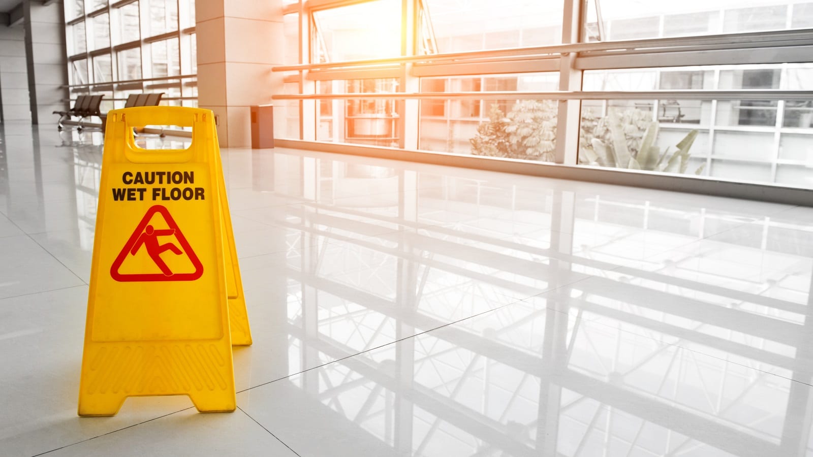 Yellow Caution Sign In Hallway Stock Photo