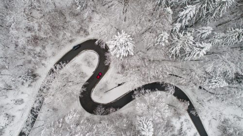 aerial-view-of-snowy-curvy-road