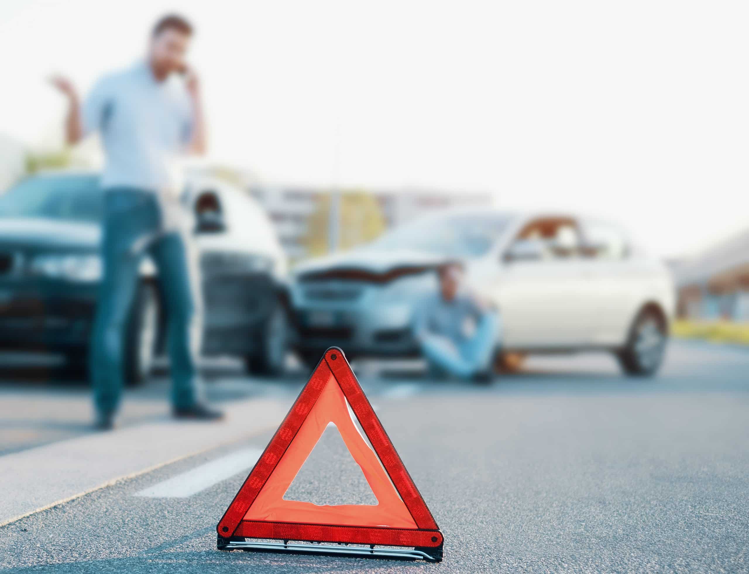man calling a car accident lawyer after an accident in Colorado Springs