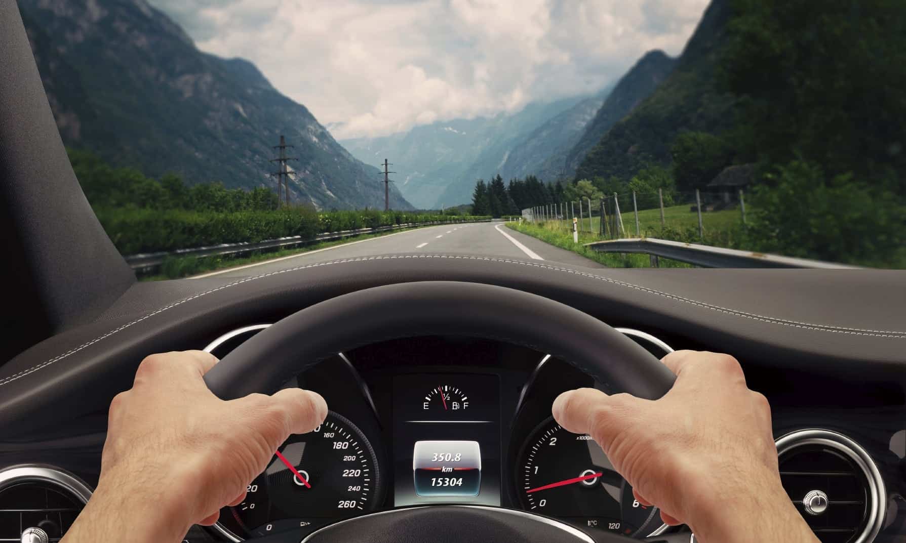 Man Driving Vehicle On Rural Highway During Cloudy Weather